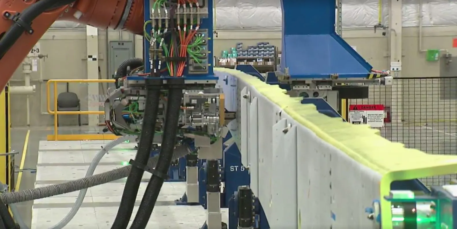 The robot making its first hole in the 777X spar