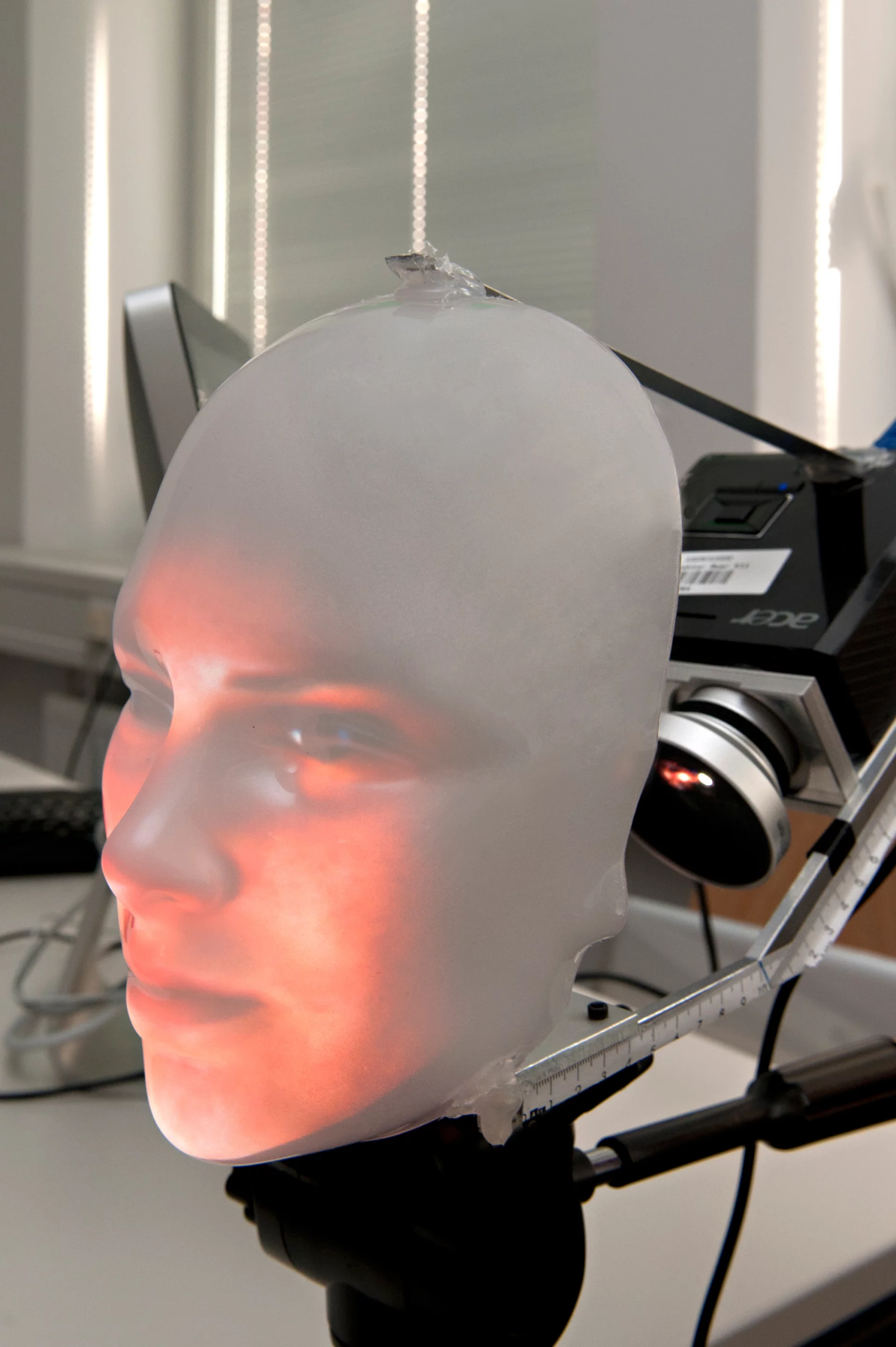 Mask-bot's projected face is bright enough to be seen in daylight