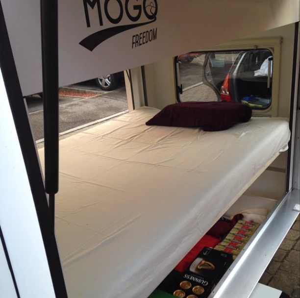 The bed conceals storage below