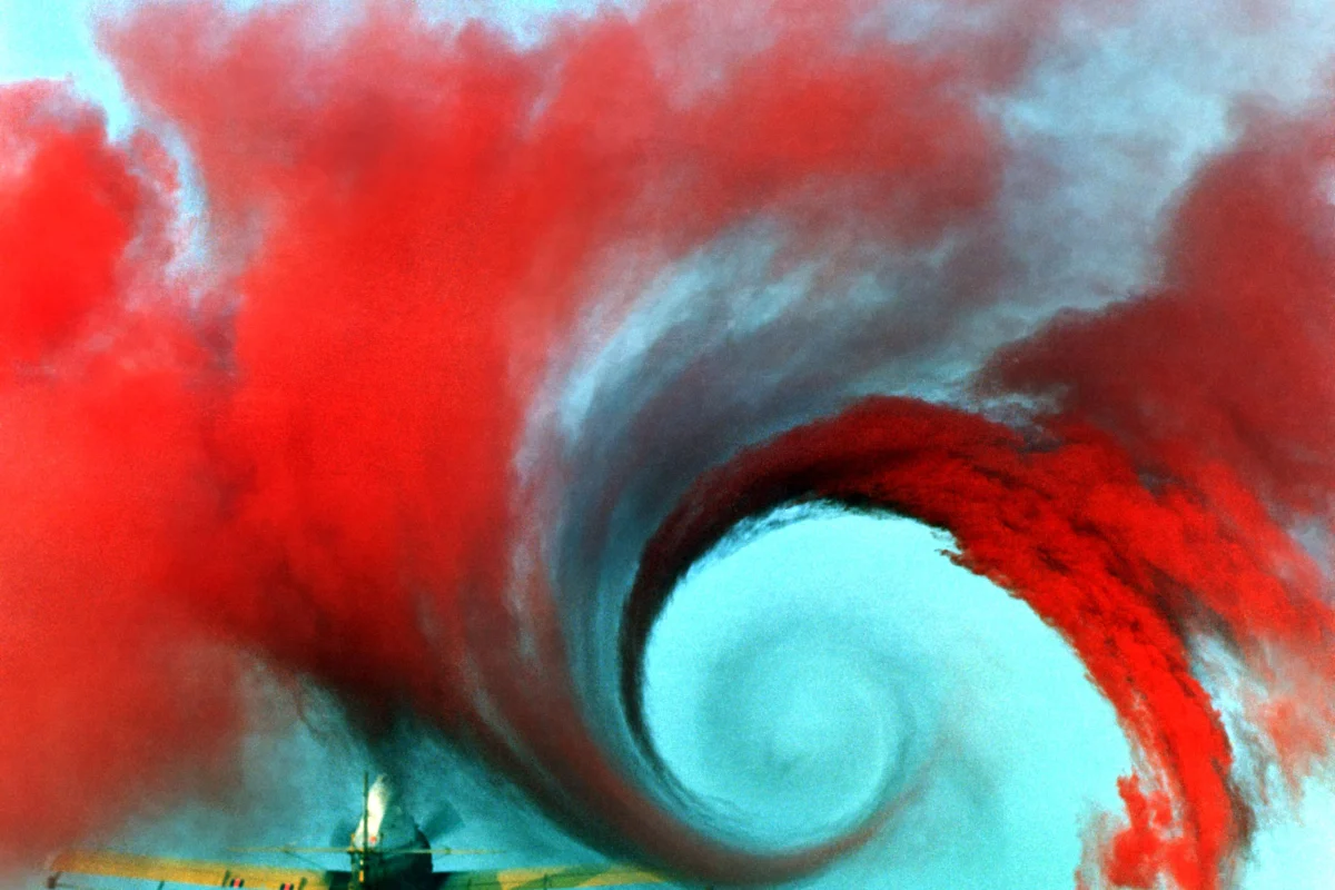 Airplane creating vortices made visible by colored smoke (Image: NASA Langley Research Center )