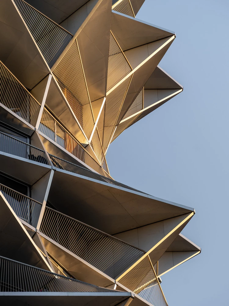The skewed floor slabs add to the architectural intrigue, creating a dynamic and modern aesthetic that sets the development apart