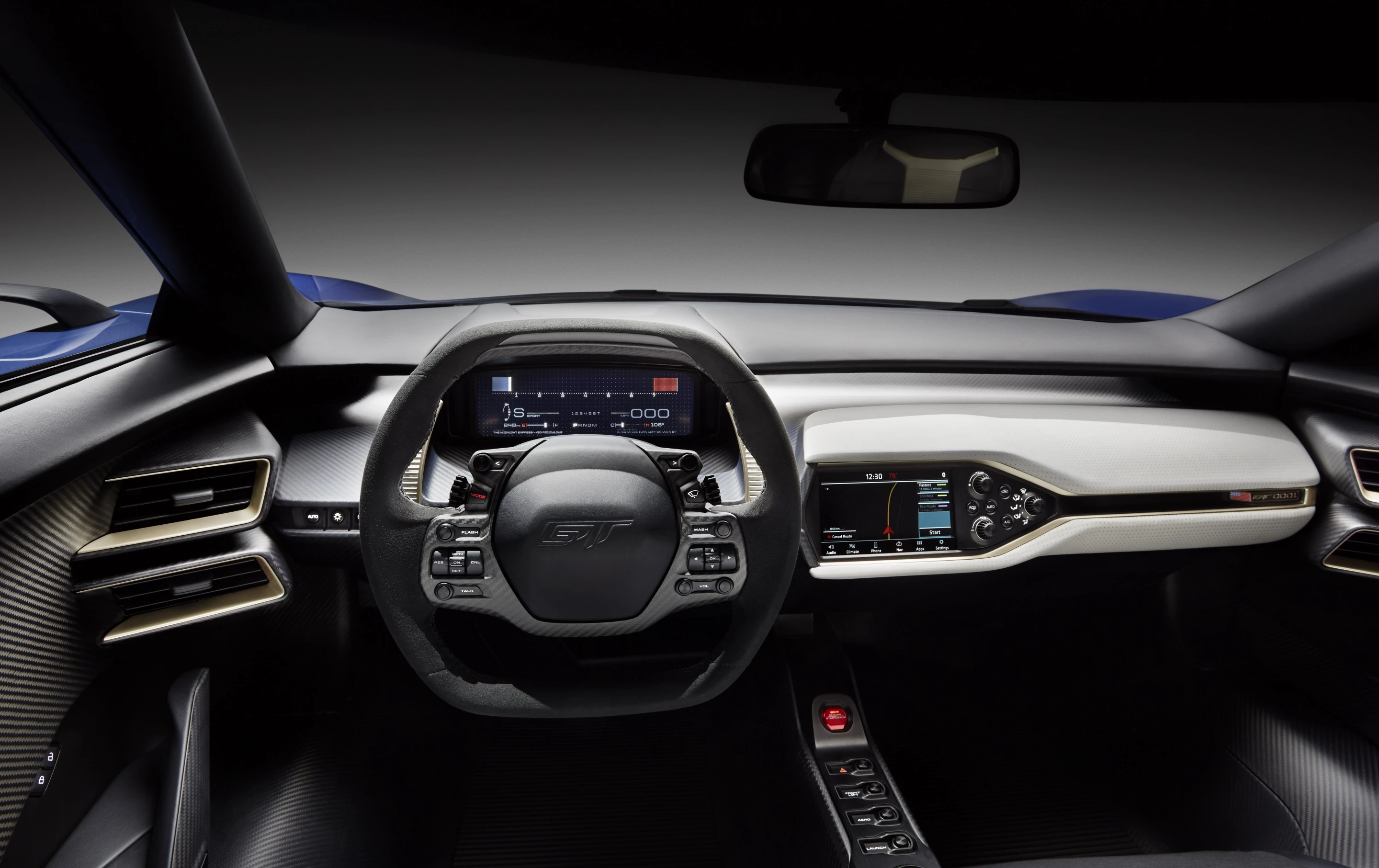 The two-seat cockpit is accessed by upward-swinging doors, and features driver and passenger seats integrated directly into the carbon fiber passenger cell. This configuration significantly reduces seating hardware and weight, and provides a consistent and Ford claims the arrangement offers a “direct sensory connection to the chassis.” The fixed seating means that Ford has employed adjustable pedals and steering column to accommodate a very wide range of driver statures.