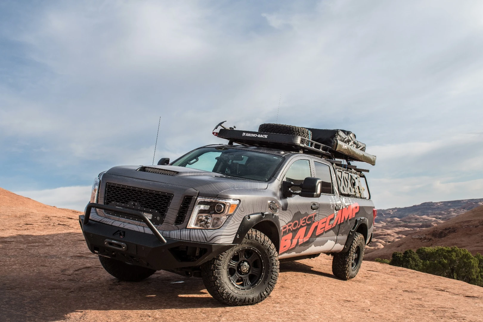 The roof rack on the Titan XD is home to a tent and awning