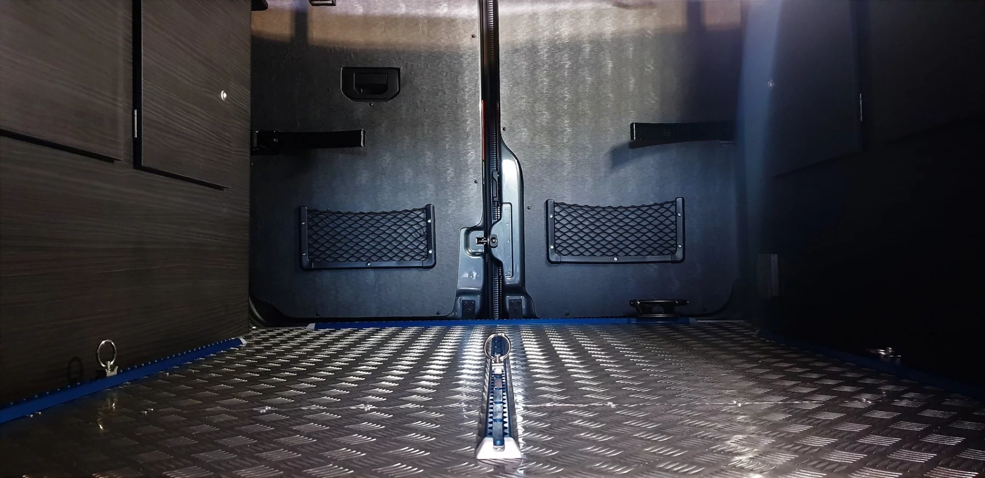 Unlike other Mclaren camper van conversions, which feature a walled-off interior separated from the rear double doors, the Savage allows for through-loading