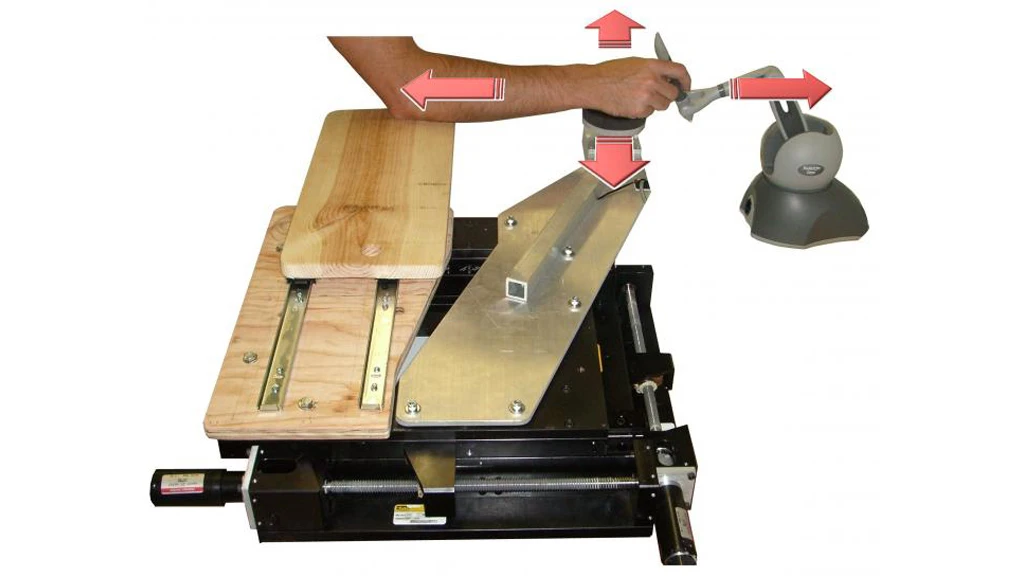 A prototype of the Active Handrest is shown here with a person using it to manipulate a stylus for writing or drawing (Image: The University of Utah)