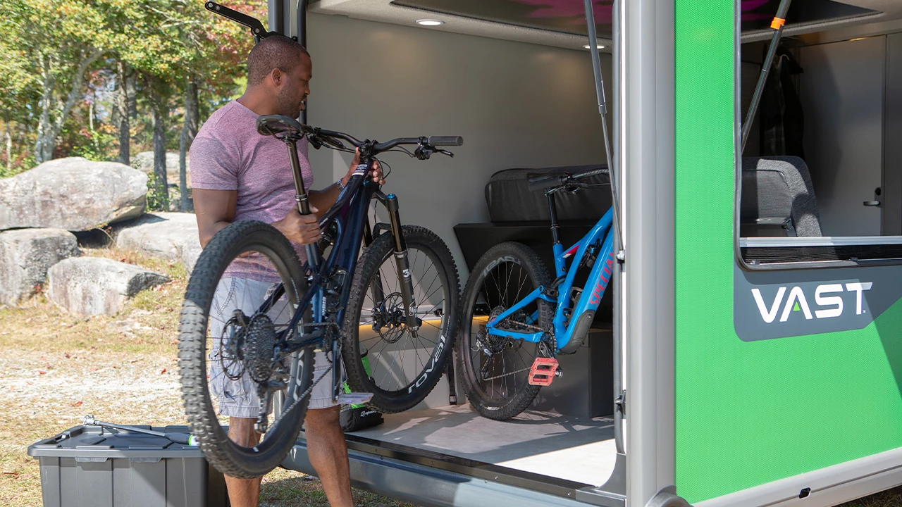 The adjustable lounge clears way for two bikes, a stack of camping gear or other cargo