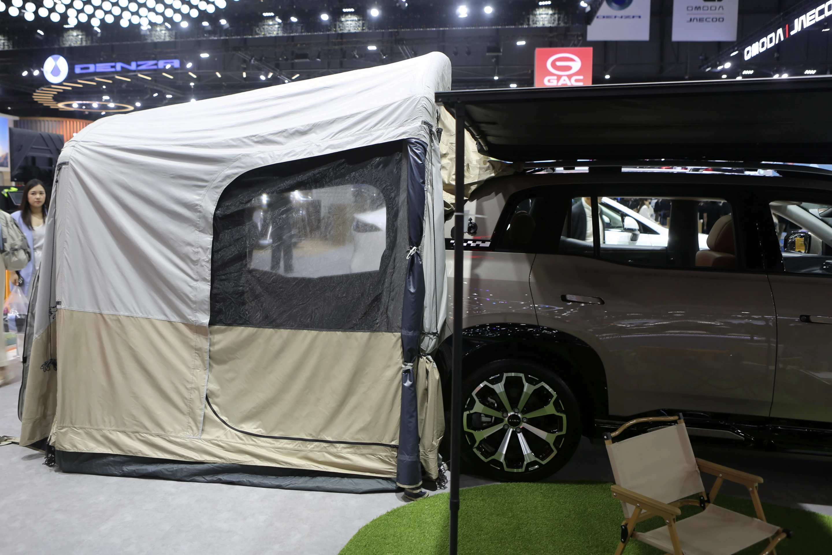 The GAC AION V SUV becomes a makeshift camper with help from a tailgate tent and side awning