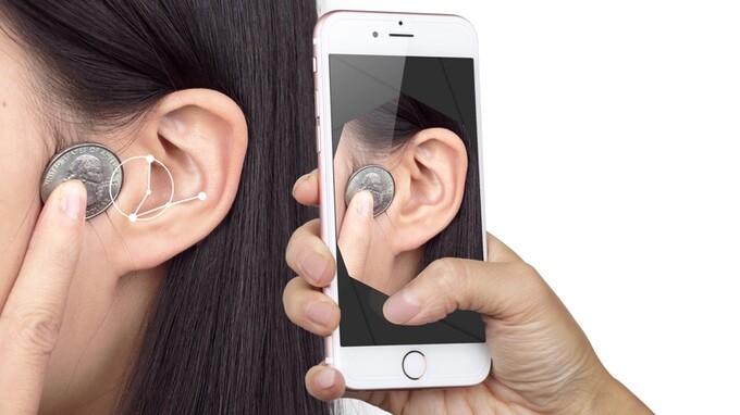 A proprietary algorithm detects key ear parameters from user-supplied ear photos and compares them with a database of thousands of human ear shapes