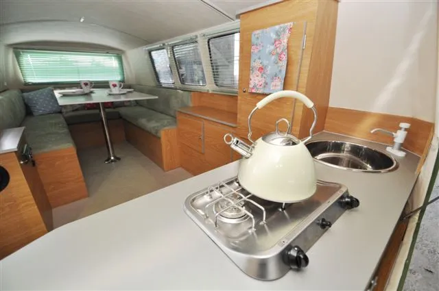 One large interior space functions as kitchen, dining/living room and bedroom