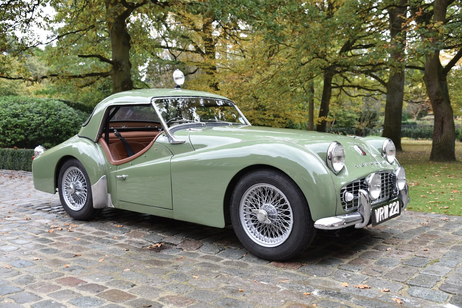The new record holder price for the model, this TR3A was one of four entered by the Triumph Works Team in the 1958 Monte Carlo Rally (it was disqualified), placing second overall in the 1958 Tour of Ireland Rally and first in class in the 1958 Tulip Rally. Impeccably presented with competition hardtop in its original colors of Apple Green over brown leather. Sold for $197,737 (€161,000)