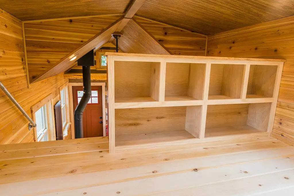 The bedroom storage in Davis's 22 ft Off-Grid Tiny Home