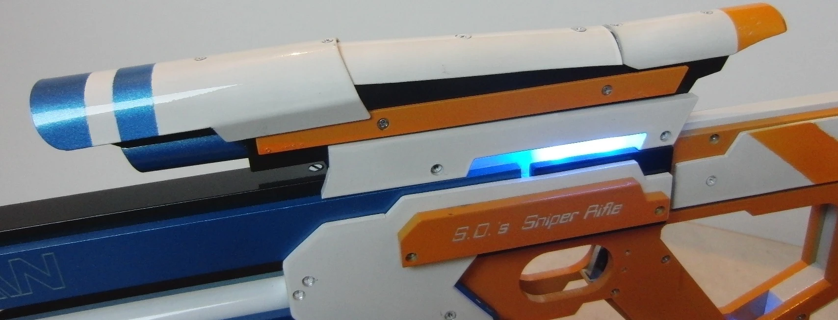 The rifle incorporates LED accent lights mounted beneath translucent plexiglass