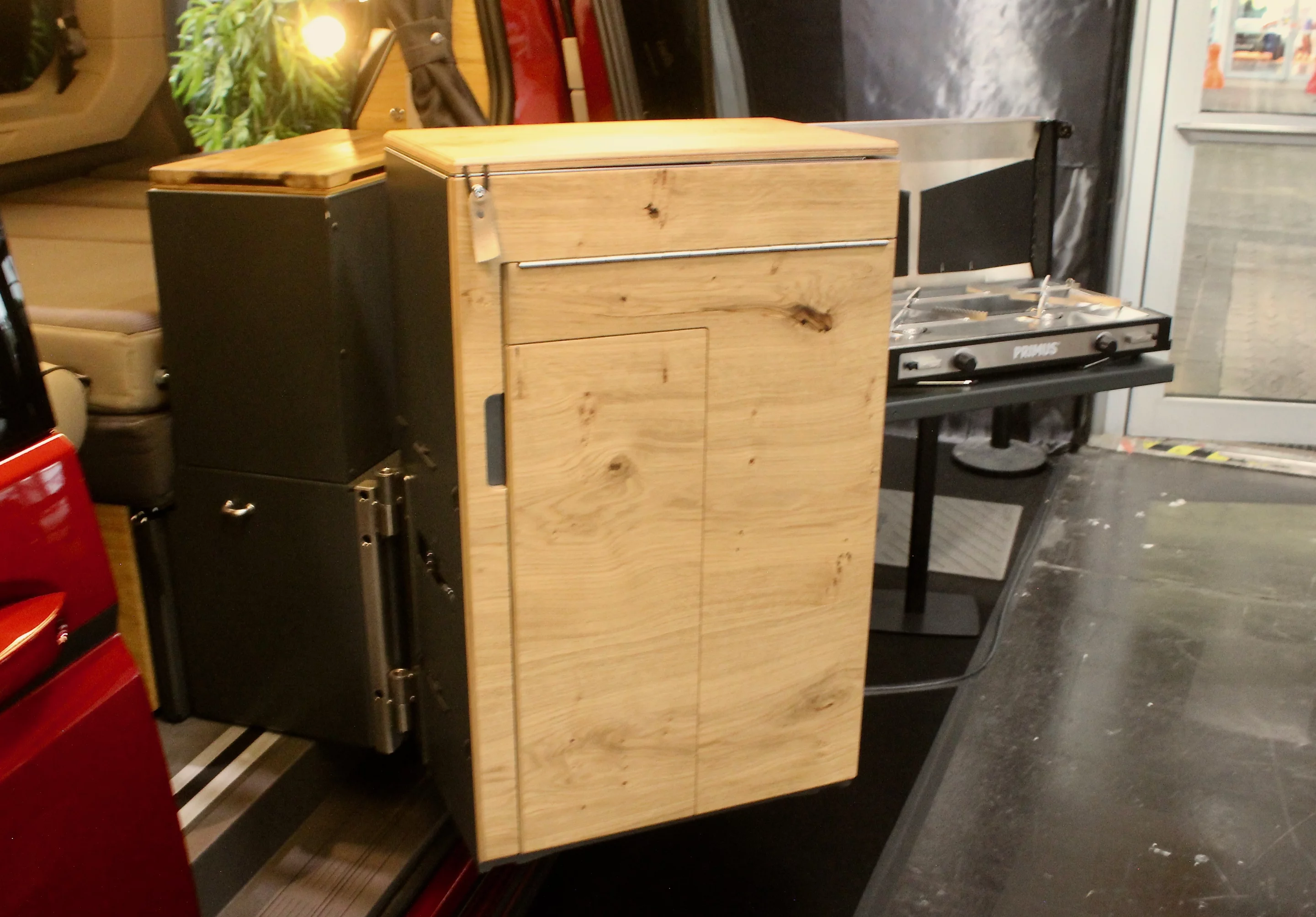 The Classic+ kitchen includes an interior fridge box and a swivel-out cooking area