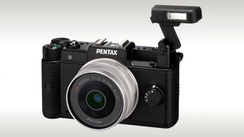 Pentax is about to release what is claimed to be the world's smallest and lightest interchangeable lens camera, and the first to sport its new Q lens mount