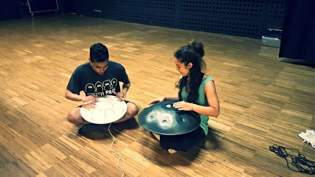 The Oval digital handpan (left) in the company of an acoustic handpan (right)