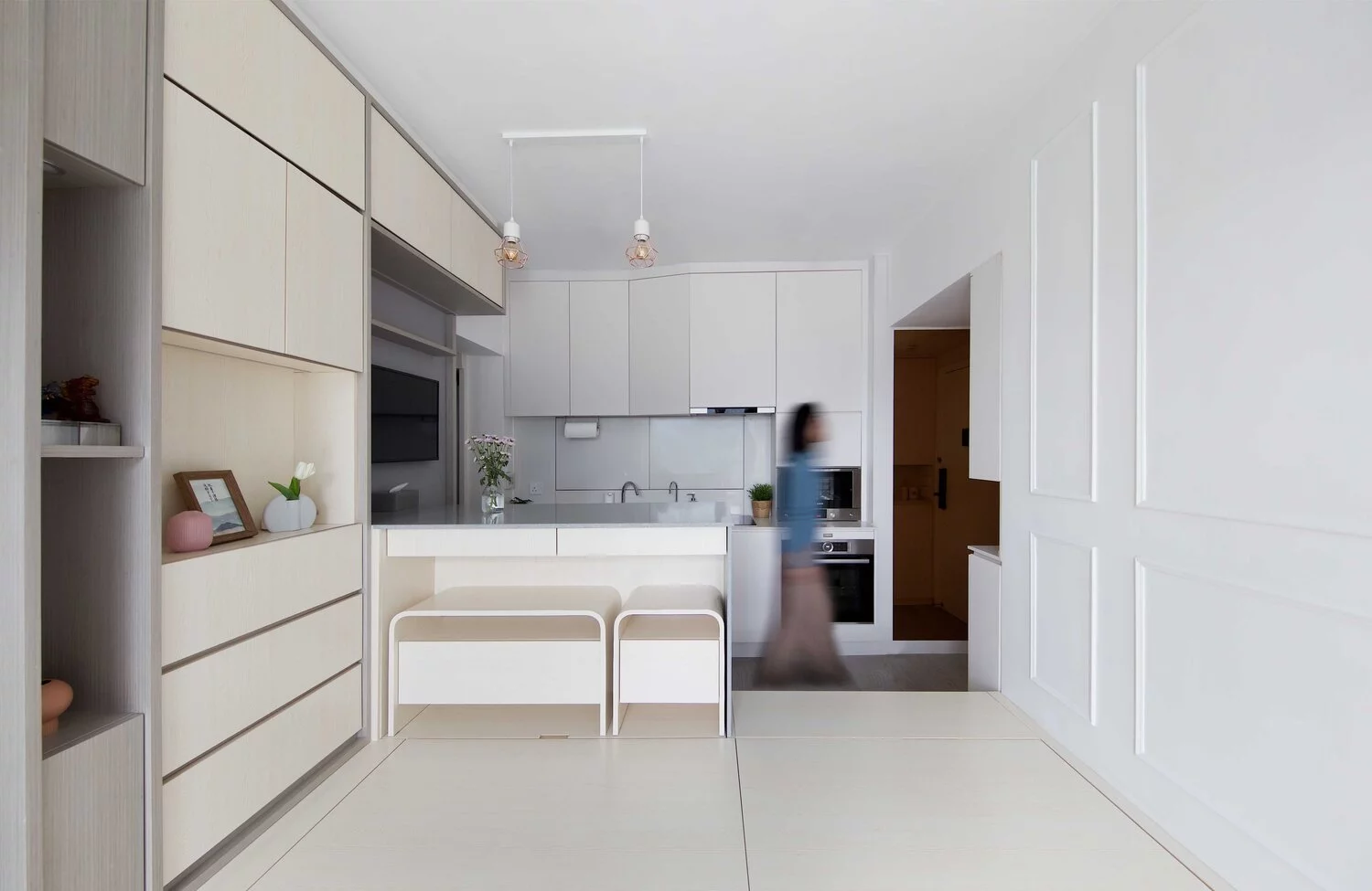 The kitchen features amble cupboard space, which takes advantage of the full height of the ceilings