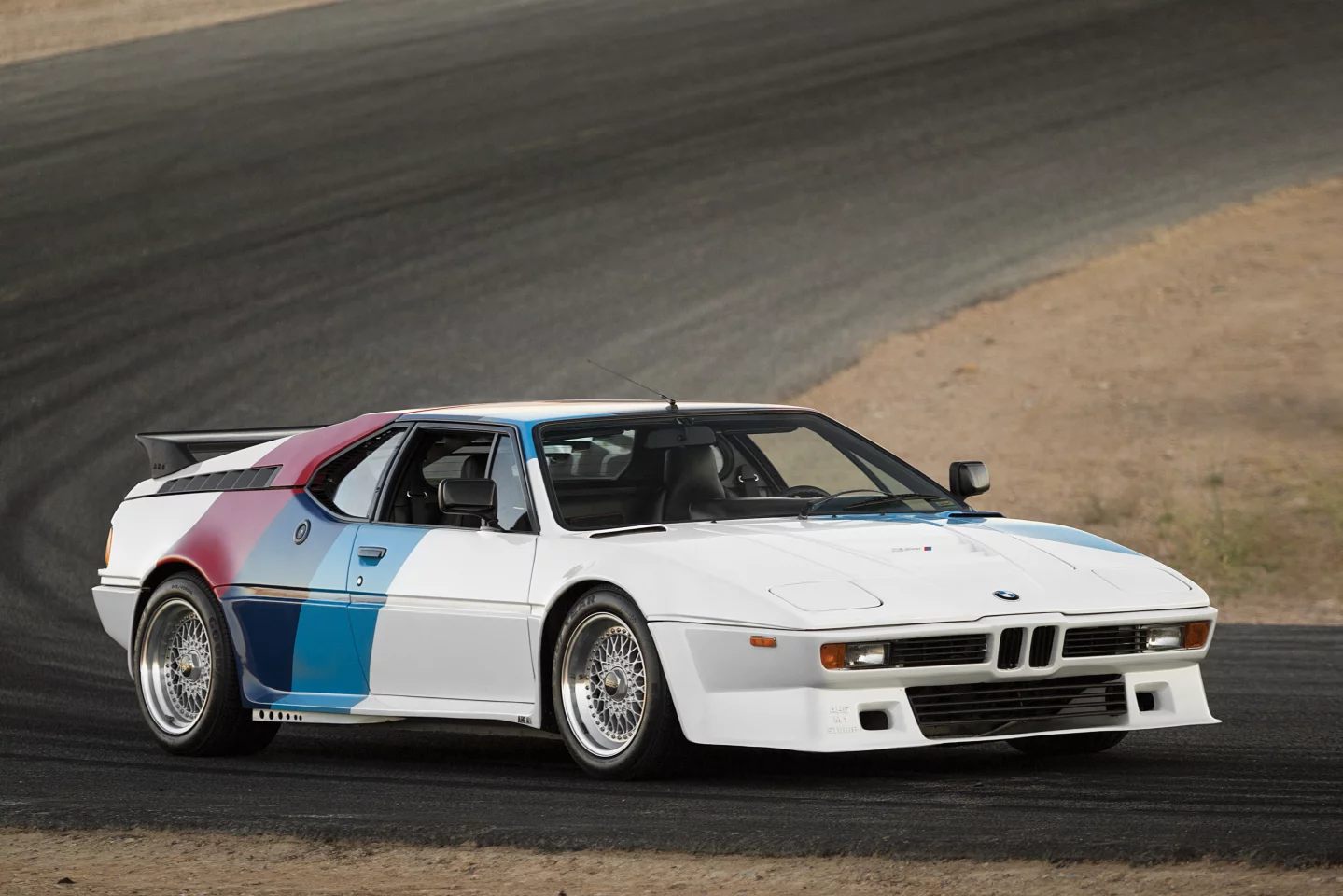1980 BMW M1 AHG Studie. Auctioneer's Estimate: US$600,000 - US$800,000. The M1 was the most exotic BMW street car ever built. It was a limited-production, virtually hand-built car that was essentially a homologation special, and it featured a tube frame and utilized state-of-the-art technology underneath the radical Giugiaro-designed body. Just 456 examples were built. This car is one of only 10 examples created by AHG, has been uprated to 350 horsepower, and comes with M1 Procar-style bodywork and BMW Motorsport tri-color livery. It's original and unrestored, with less than 7,000 km on the odomoter. Official Auction Description and Images