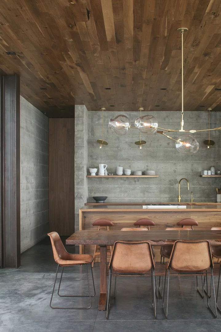 The Off-Grid Guest House's interior is finished in a tasteful palette of concrete, steel, and wood