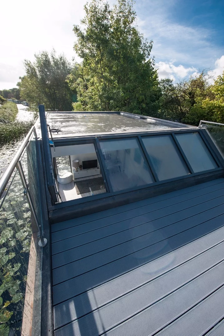 The Chichester floating home has a roof terrace with glass balustrades