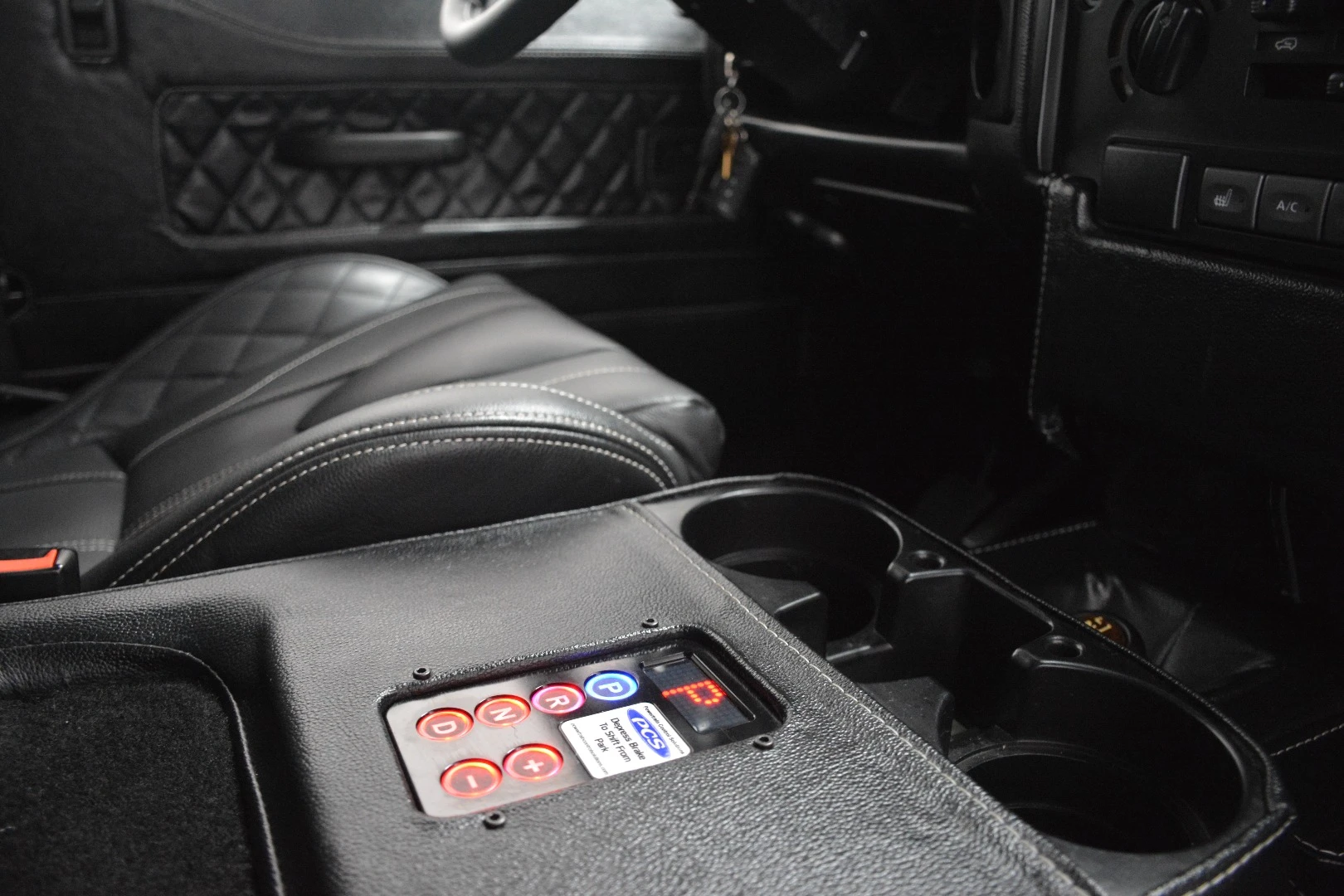Modifications include a push-button drive shifter