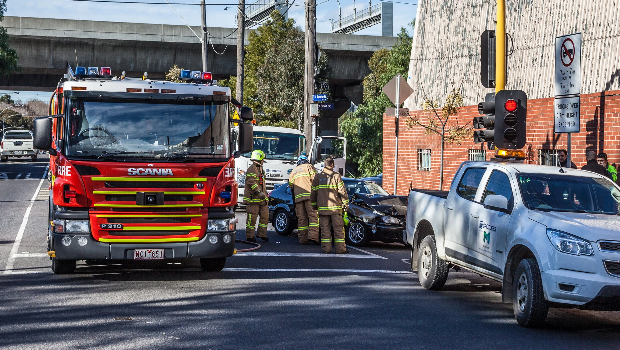 "A car's collided with the back of a truck and caused a moderate amount of damage to the car. The front of the car's gone underneath the truck."