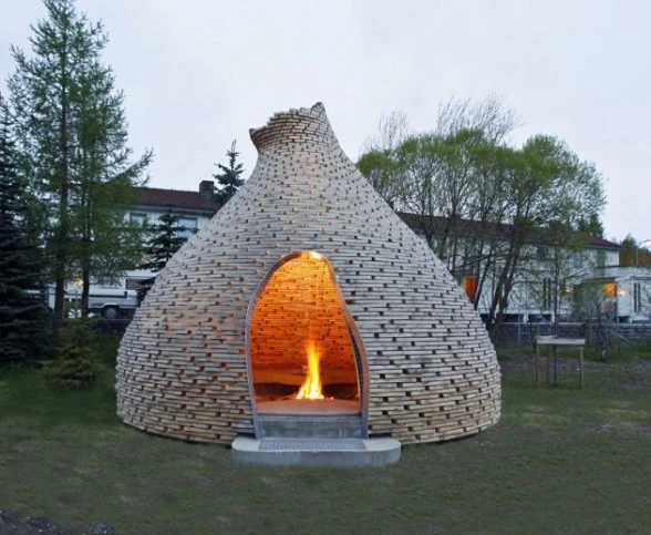 The structure is made of 80 layered circles and features an internal seating area where friends can gather around the fire and share stories