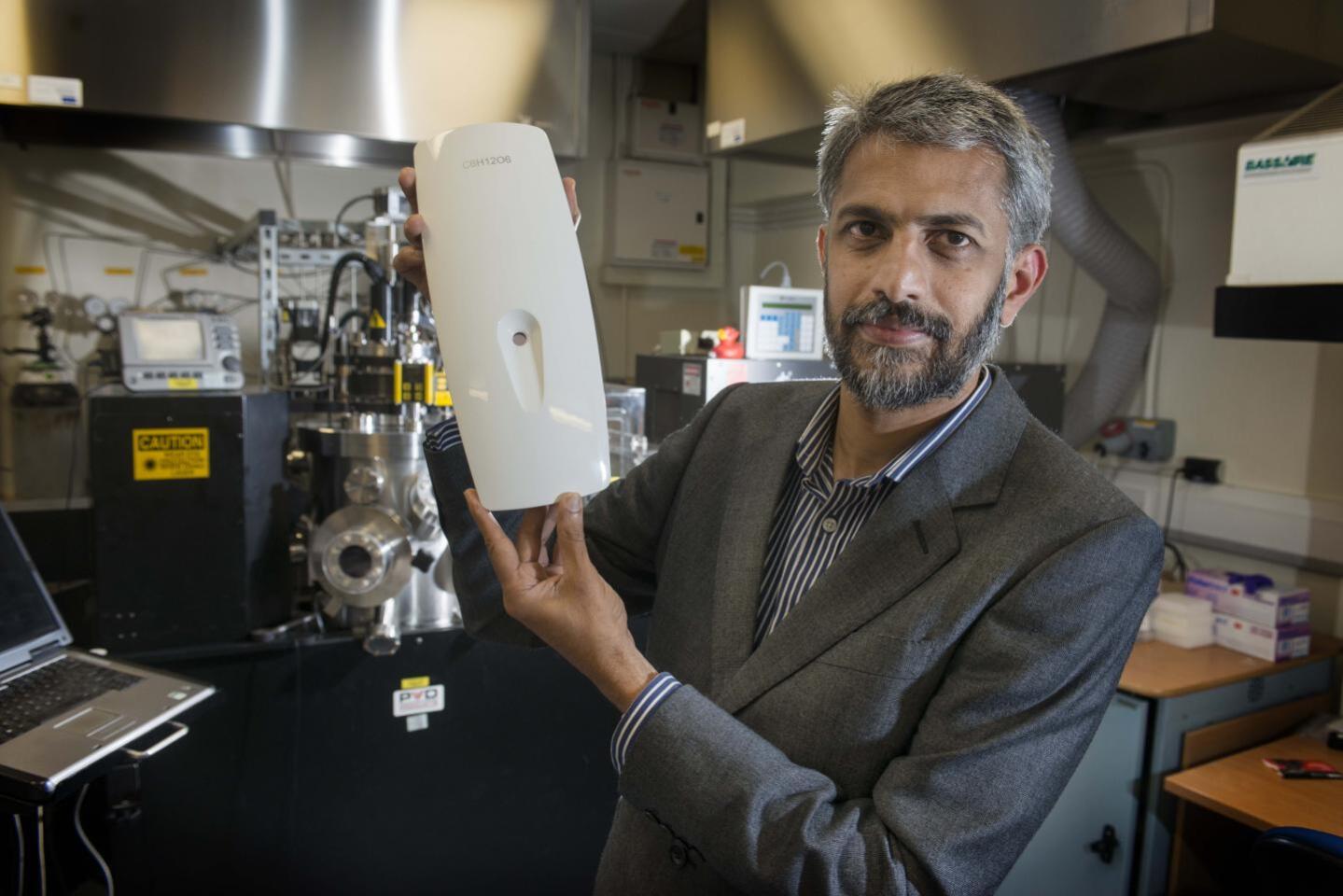 Prof. Gin Jose with the GlucoSense prototype