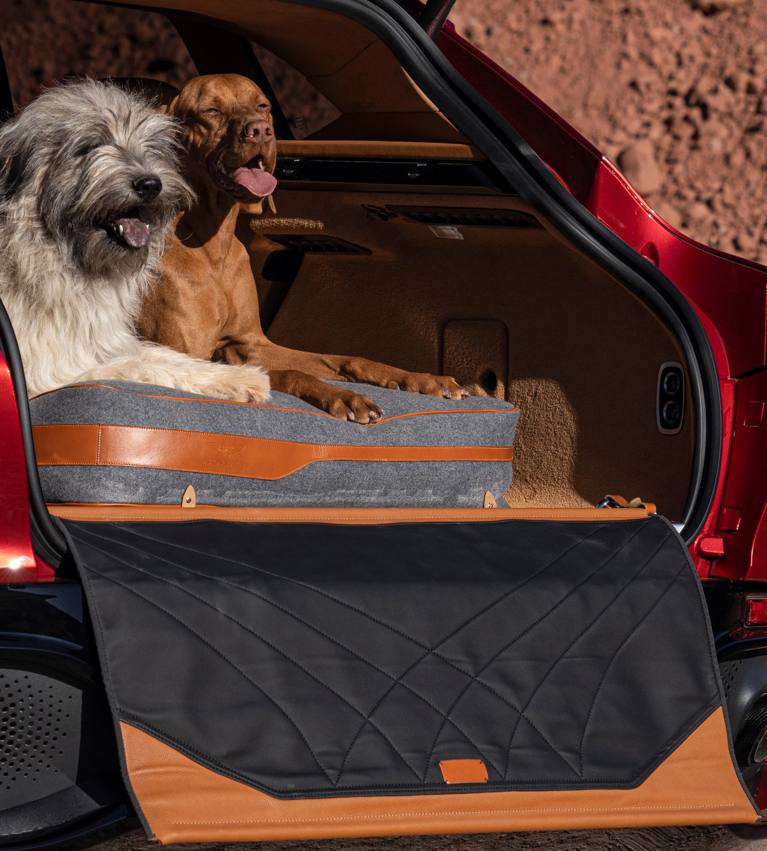 A Pet package can include this pet bed and protective cargo area covering that includes a leather guard for the rear fascia