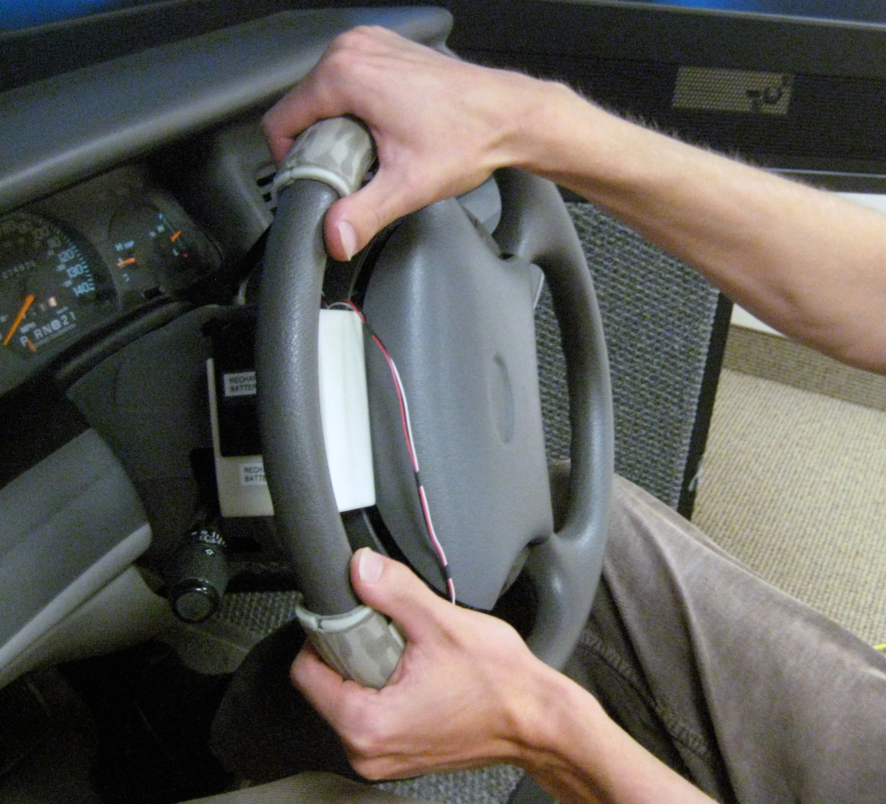Two devices, mounted on the steering wheel of a driving simulator, convey navigation information to the driver (Image: Nate Medeiros-Ward, University of Utah)