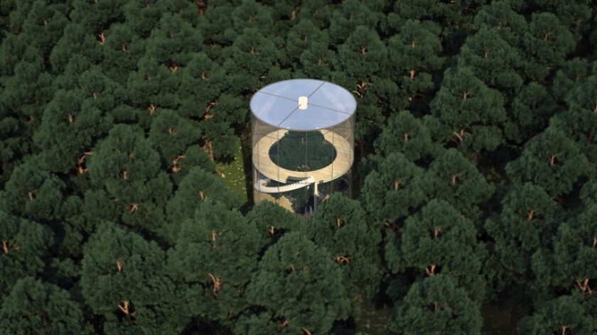 The unusual home is a simple structure consisting of a cylindrical glass shape and four floors accessible via spiral staircase (Image: A.Masow)