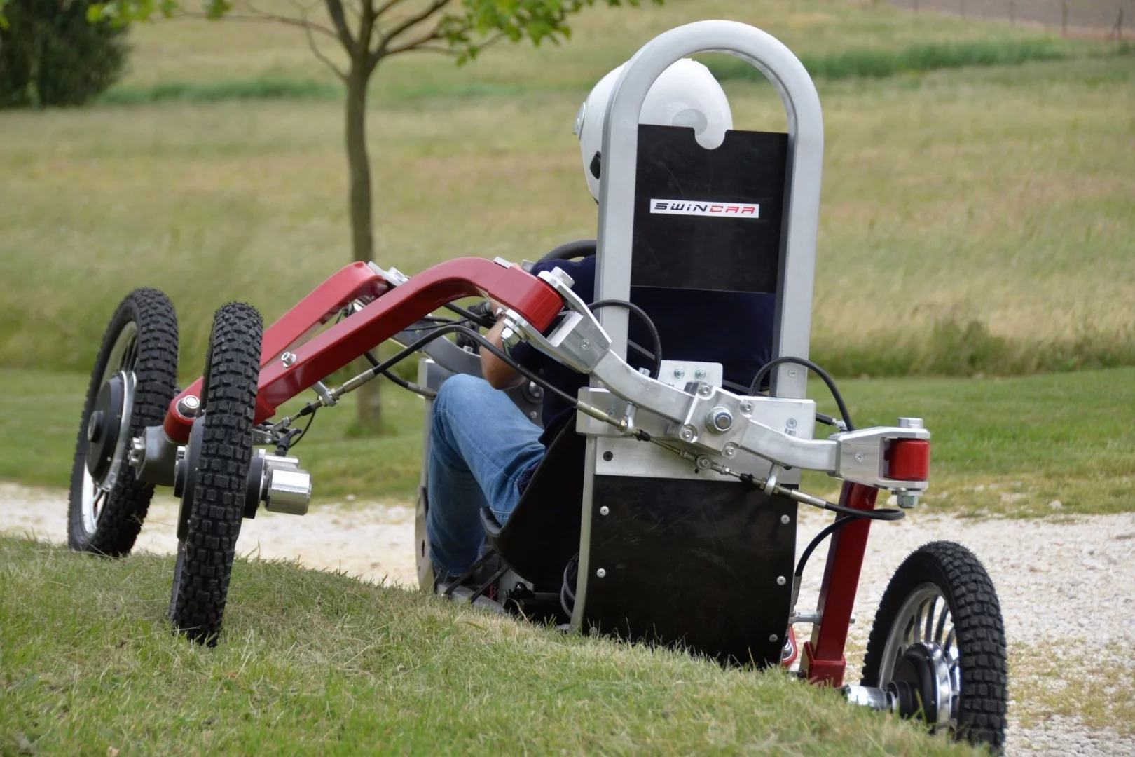 Swincar - strong resistance to rollover, but the seat back acts as a roll bar in an emergency