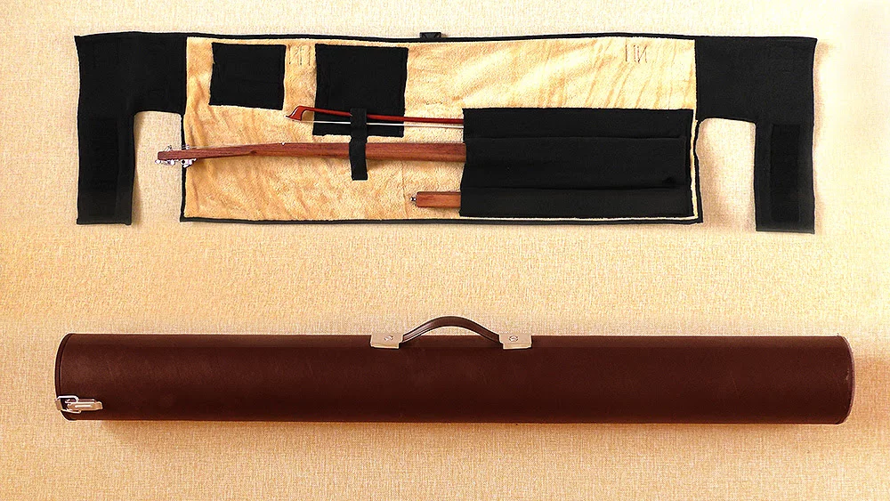 A soft bag and travel case are included in the package