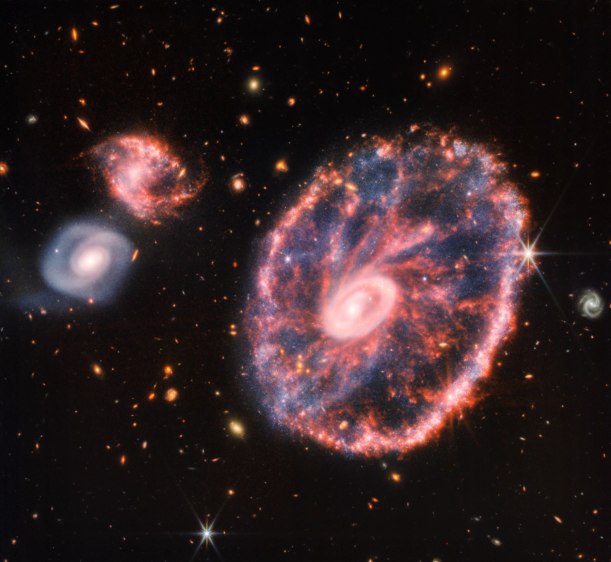The James Webb Space Telescope has produced a stunning new view of what's known as the Cartwheel Galaxy