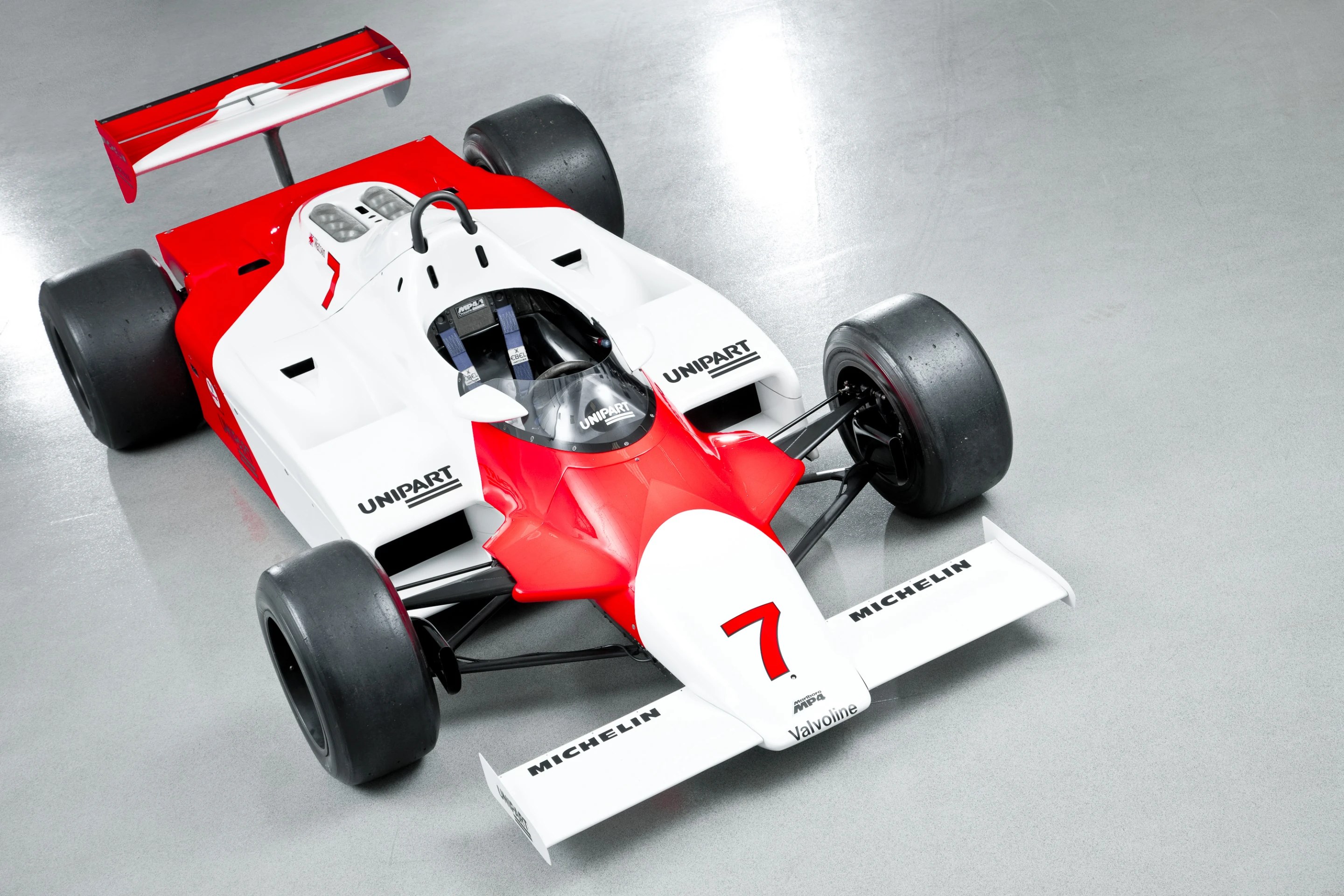The MP4/1 was the first carbon composite car in F1 and the first to implement a carbon fiber monocoque and the "lay-down" driver position