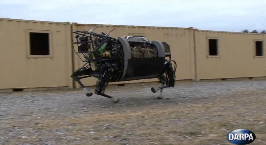 DARPA's quadruped robot can trot at up to 7 miles per hour in more structured environments, like this mock urban area