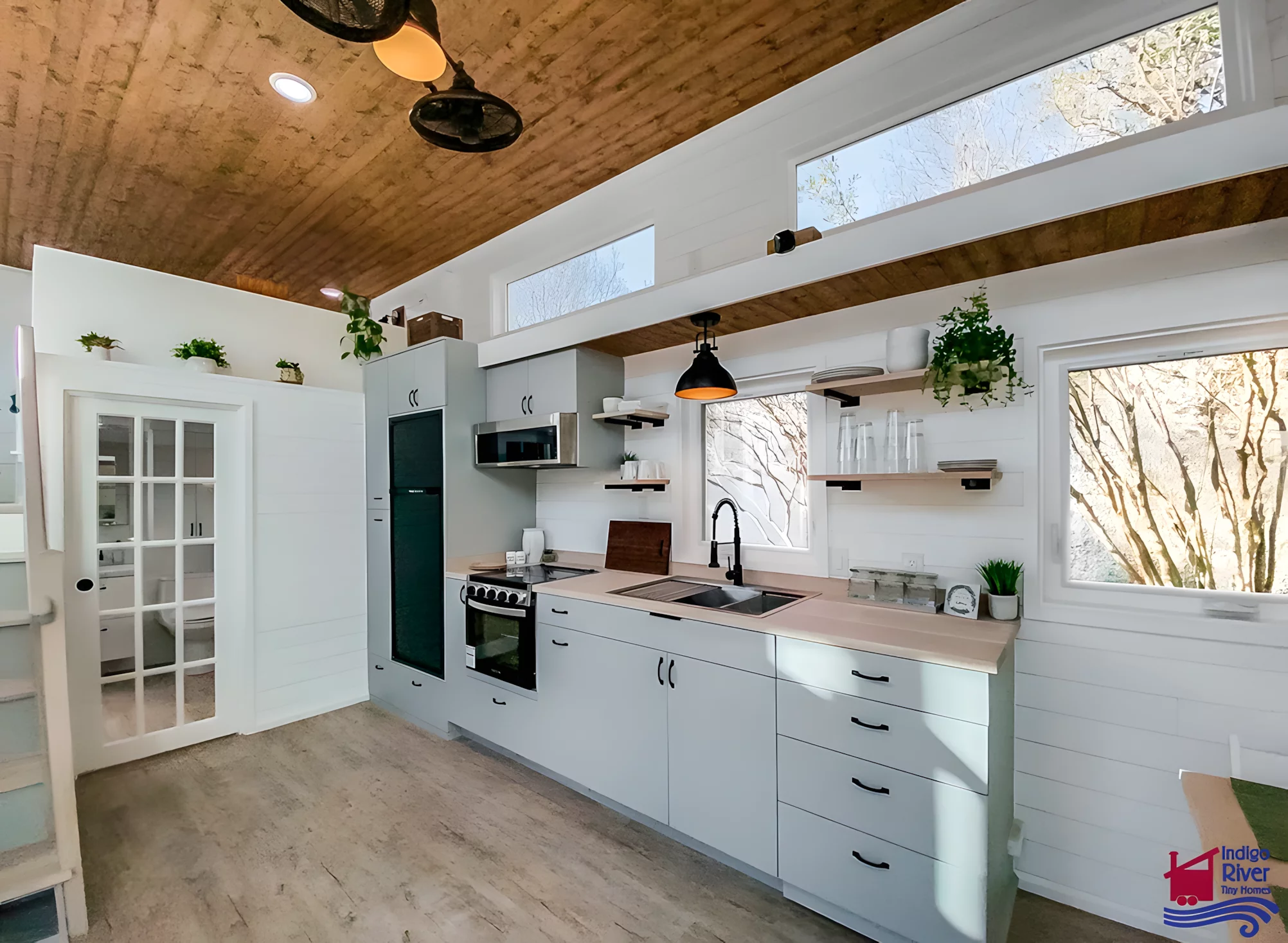 The Elsie's kitchen includes a sink, oven, induction stove, fridge/freezer, and quite a lot of cabinetry