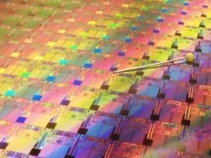 Processors on an Intel 45nm Hafnium-based High-k Metal Gate ''Penryn'' Wafer photographed with a pin