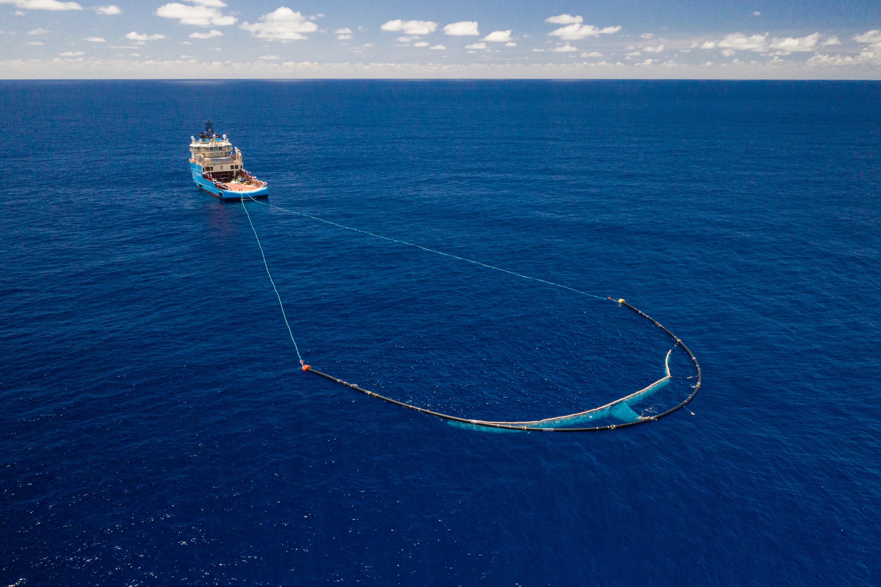 The Great Ocean Cleanup team envisions fleets of its U-shaped barrier drifting through the Great Pacific Garbage Patch eating up plastic waste like a giant Pac-Man