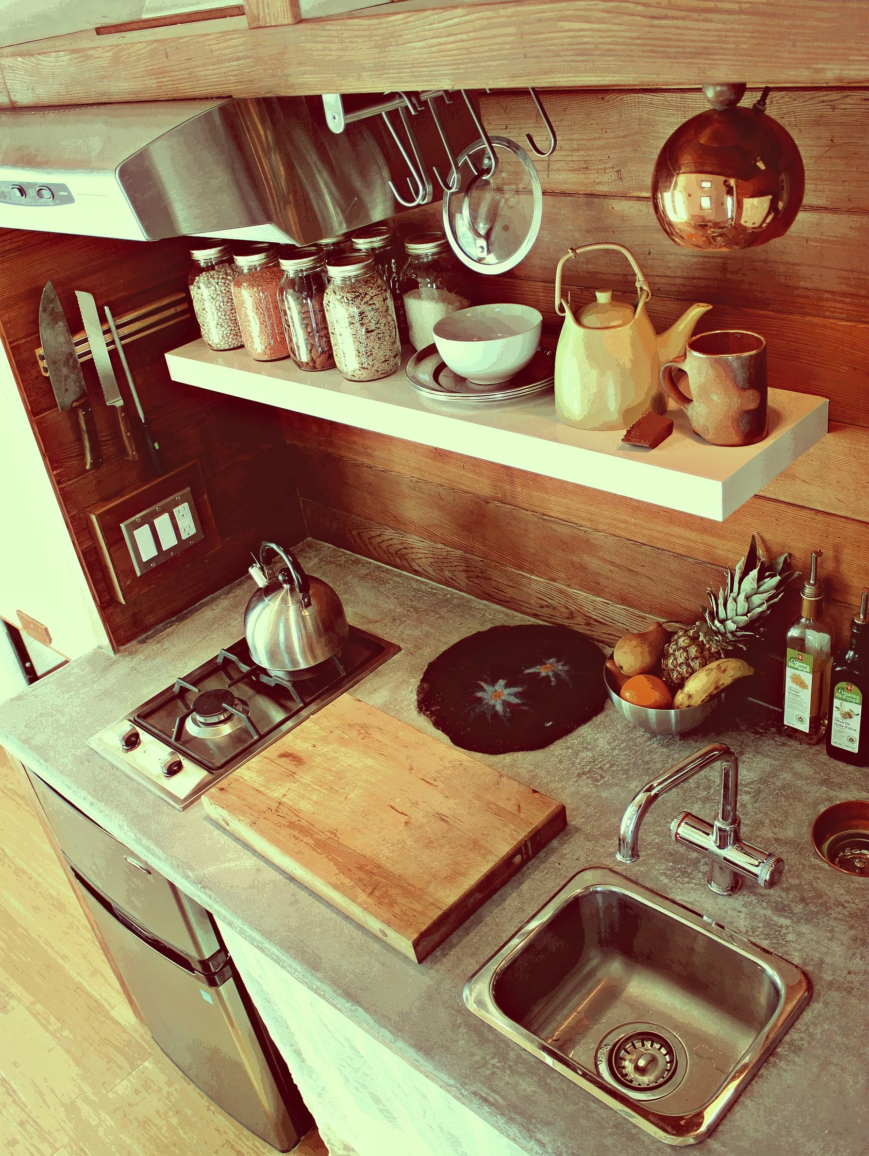 The kitchen area includes a double stove, sink and small fridge freezer (Photo: Laird Herbert)