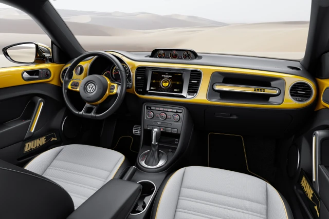 The interior features black leather and Gobi sport fabric upholstery, aluminum dash accents, and a high-resolution 7.7-inch AMOLED touchscreen