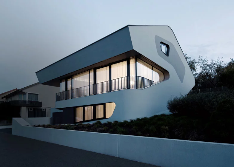 The side exterior view of the OLS House is designed to resemble a dinosaur's head