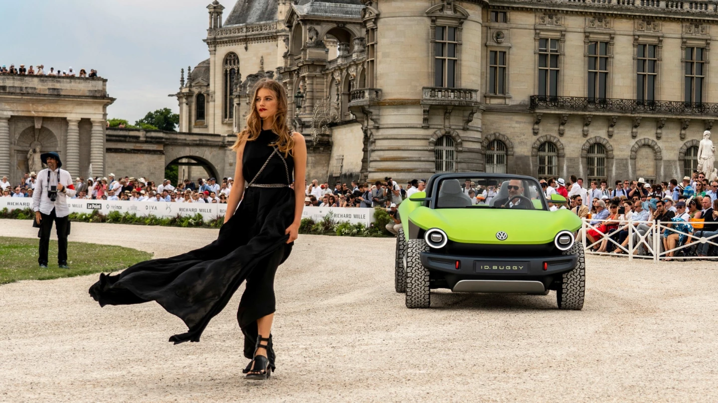 The Volkswagen ID. Buggy with model dressed by Ann Demeulemeester