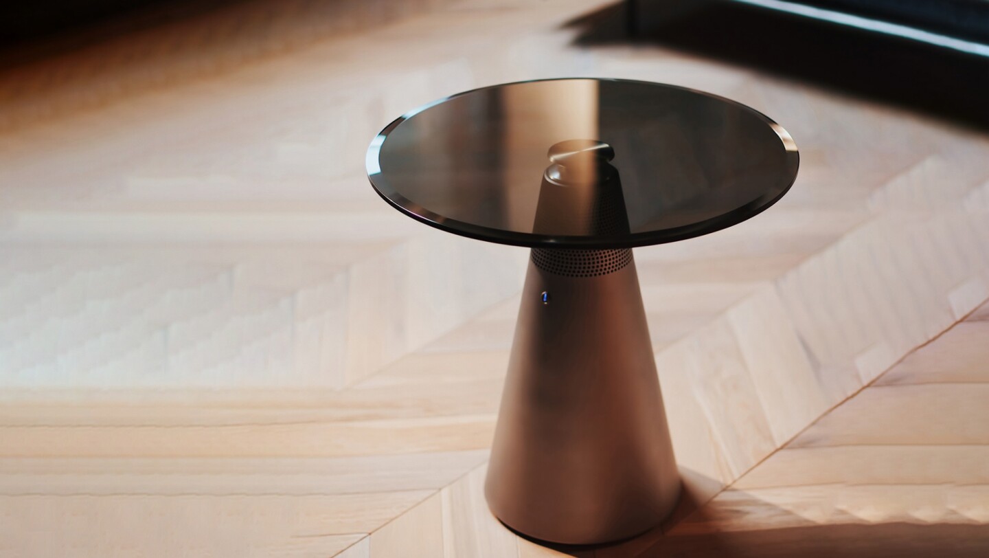 The Standesk's aluminum pedestal is topped by a tempered glass table top