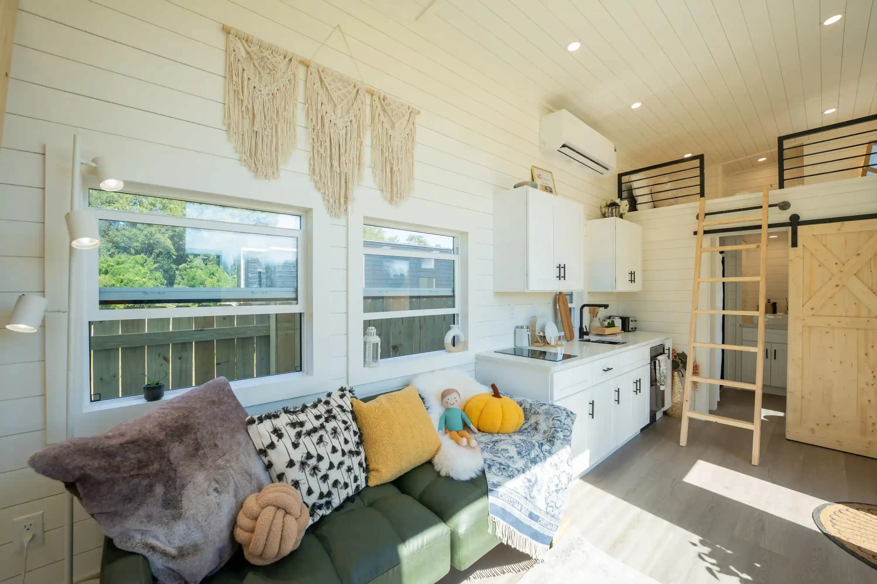 The Webster's living room includes a sofa and a wall-mounted TV
