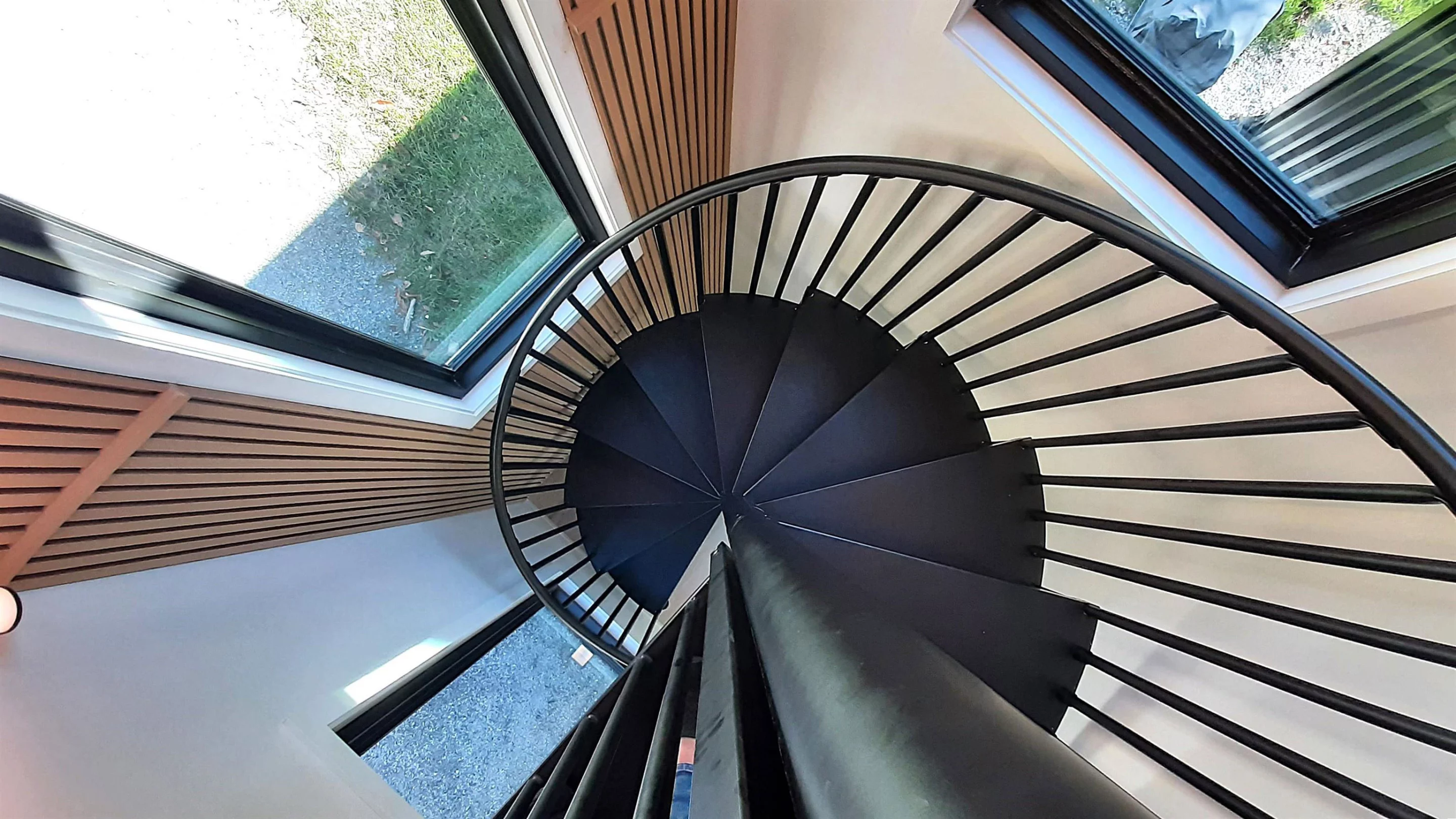 The Vermont Villa features a space-saving spiral staircase, which is installed in a container that has been arranged vertically