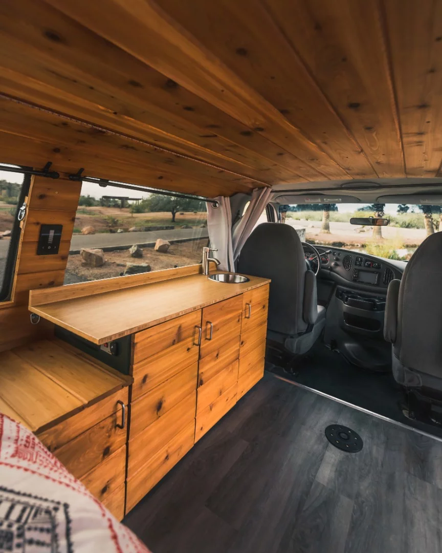 Inside the Boho Iris Ford E-350 camper van