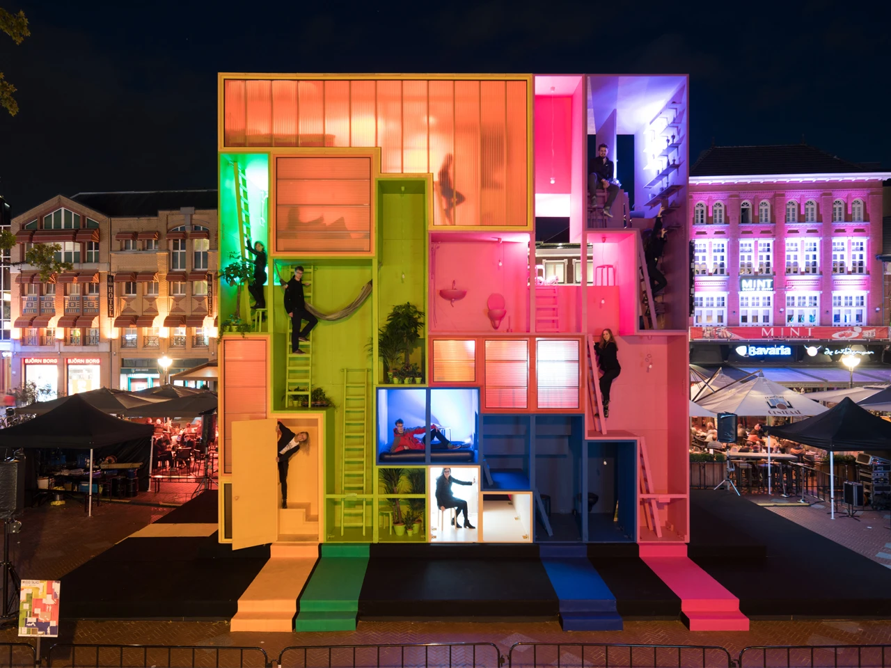 The nine colorful blocks that make up the nine-meter-tall (30 ft) Wego installation are stacked together in a Tetris meets Snakes and Ladders kinda way