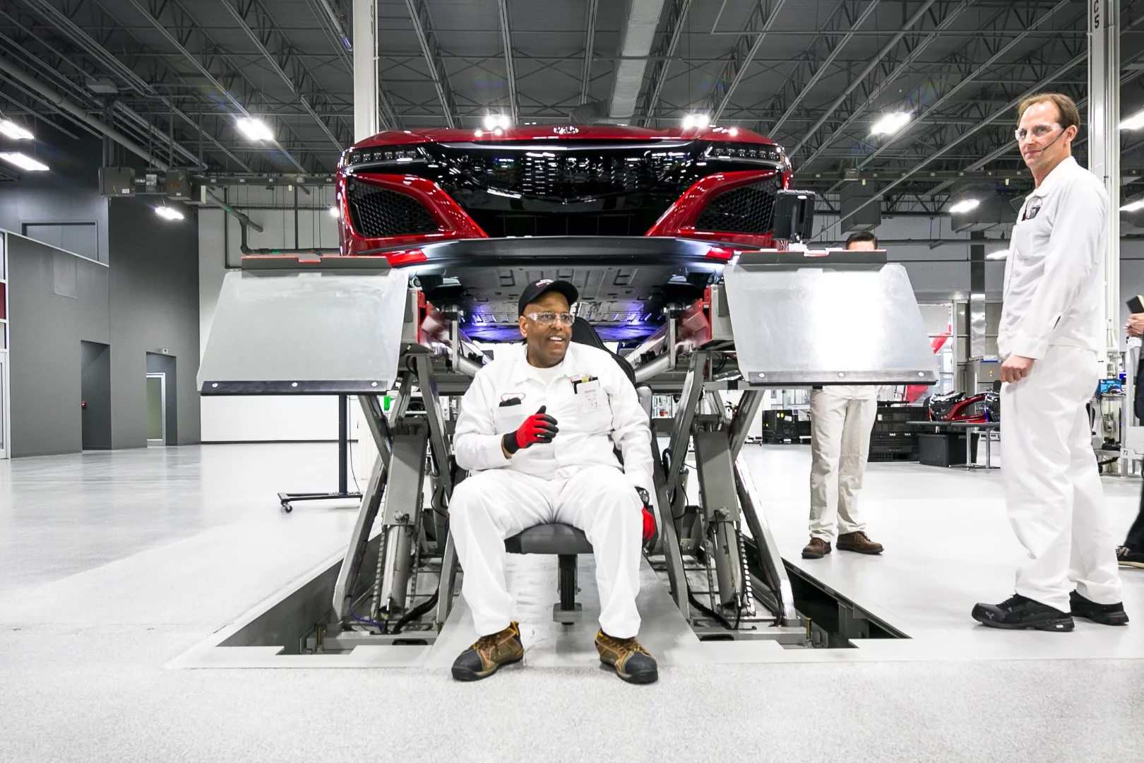 Acura designed a patent pending"Star Wars" chair for the alignment that attaches directly to the hoist and allows the techs to more comfortably perform the job