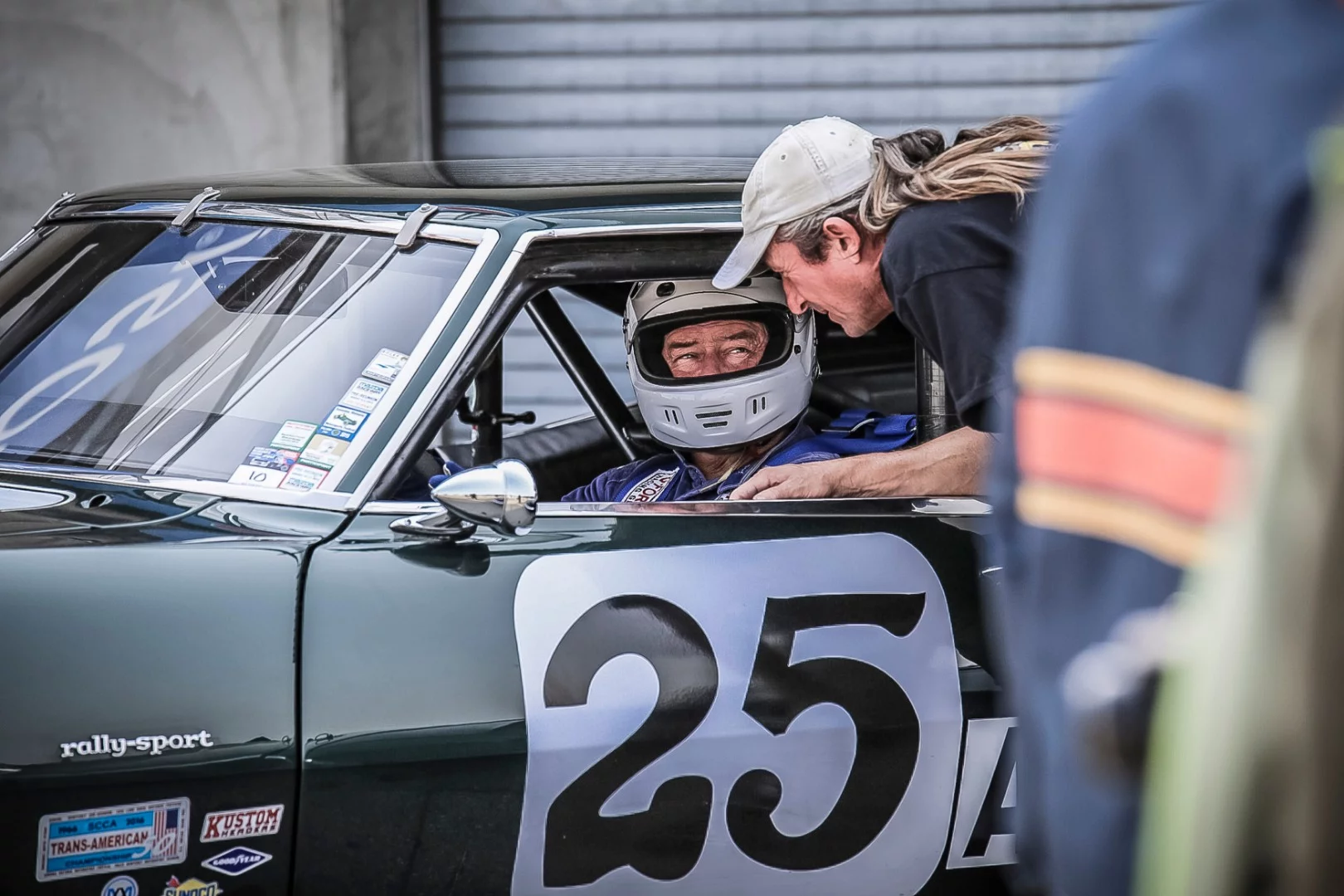 1968 Chevy Camaro Z28 shows driver, Ronald Atchley, discussing pre-race details