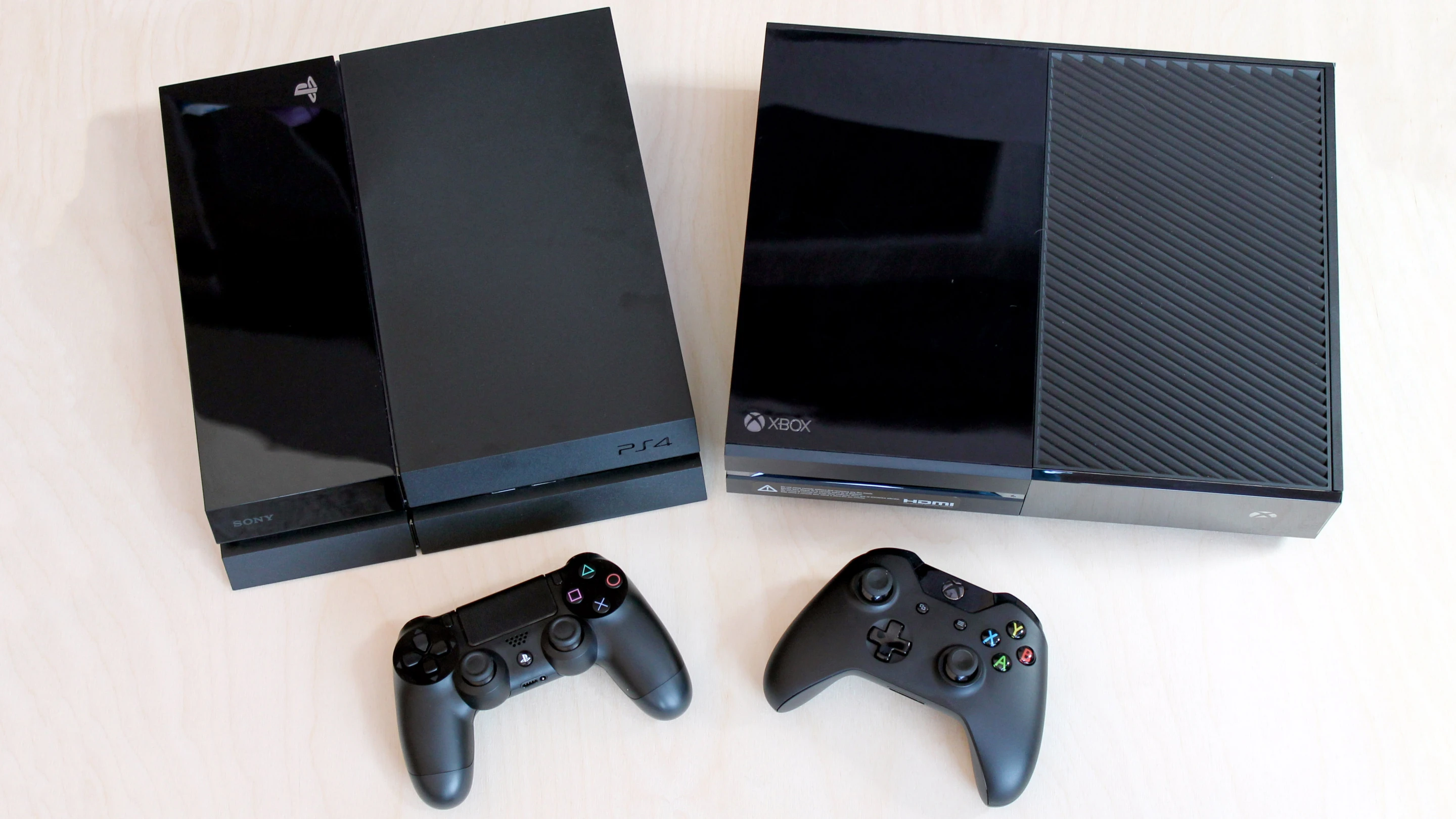 We share our extended hands-on impressions of the Sony PlayStation 4 (left) and Microsoft Xbox One
